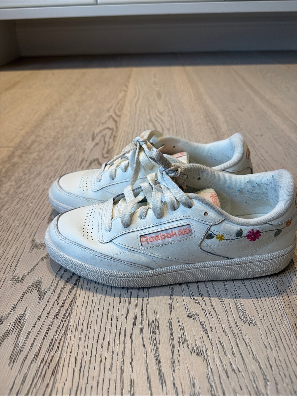 Reebok White Sneakers with Pink Logo and Floral Accent